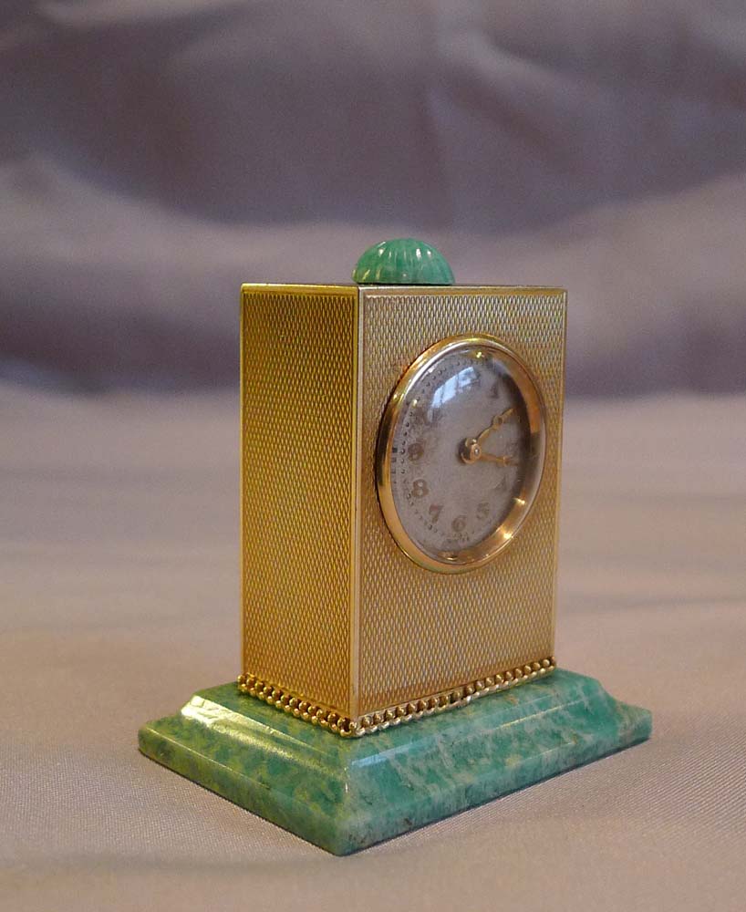 Sub miniature, cased, solid 14 carat gold jade mounted carriage clock by Geneva Clock Company.