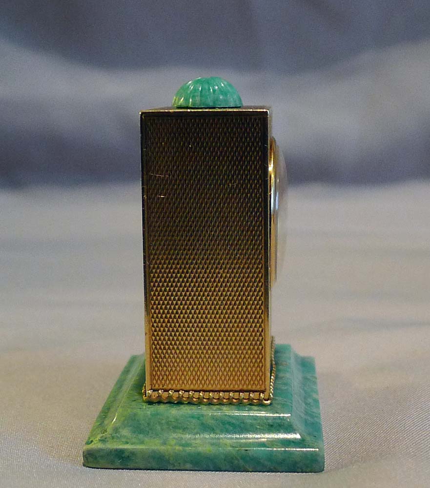 Sub miniature, cased, solid 14 carat gold jade mounted carriage clock by Geneva Clock Company.