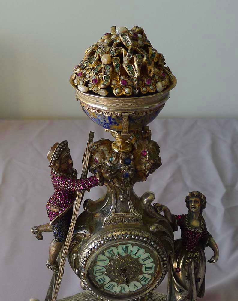 Spectacular antique Viennese silver and jewelled clock of young couple picking fruit from a tree.
