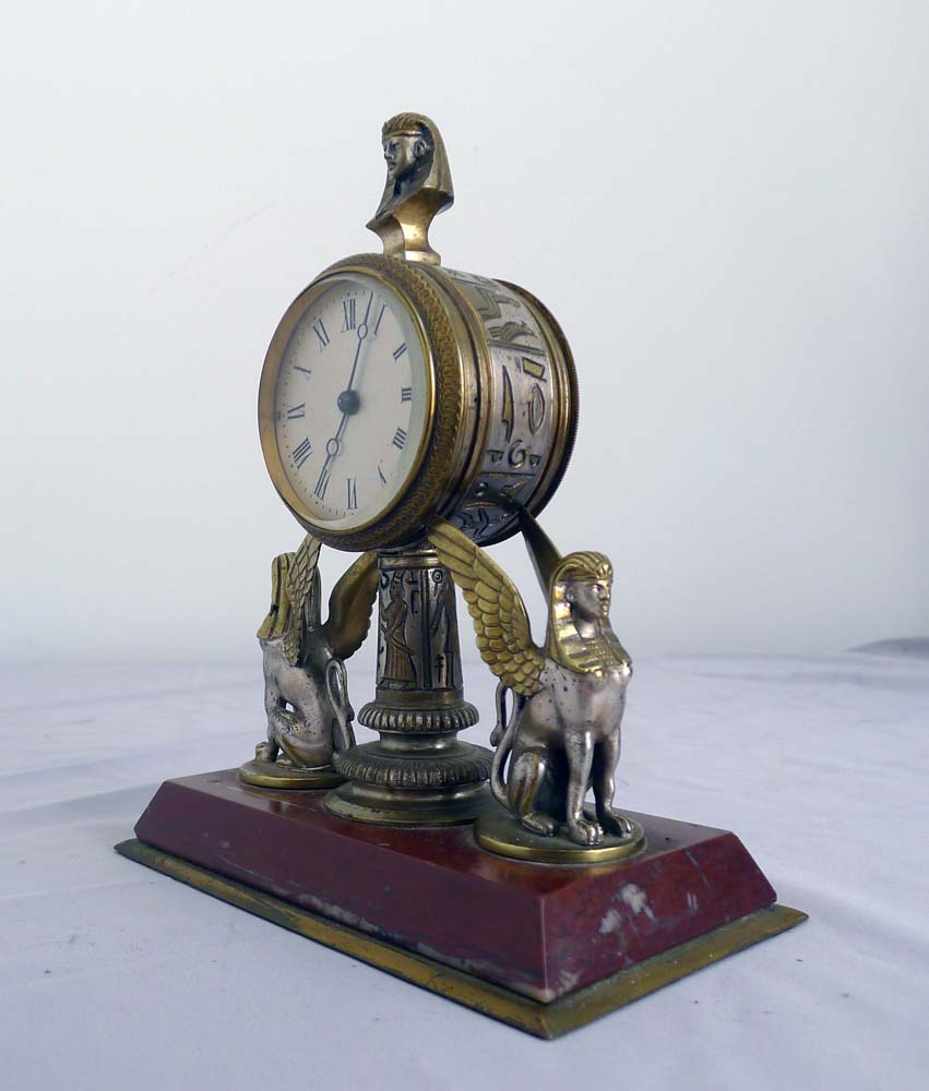 Fine and unusual desk timepiece of Retour d'Egypt or Egyptian Revival in gilt and silvered bronze.