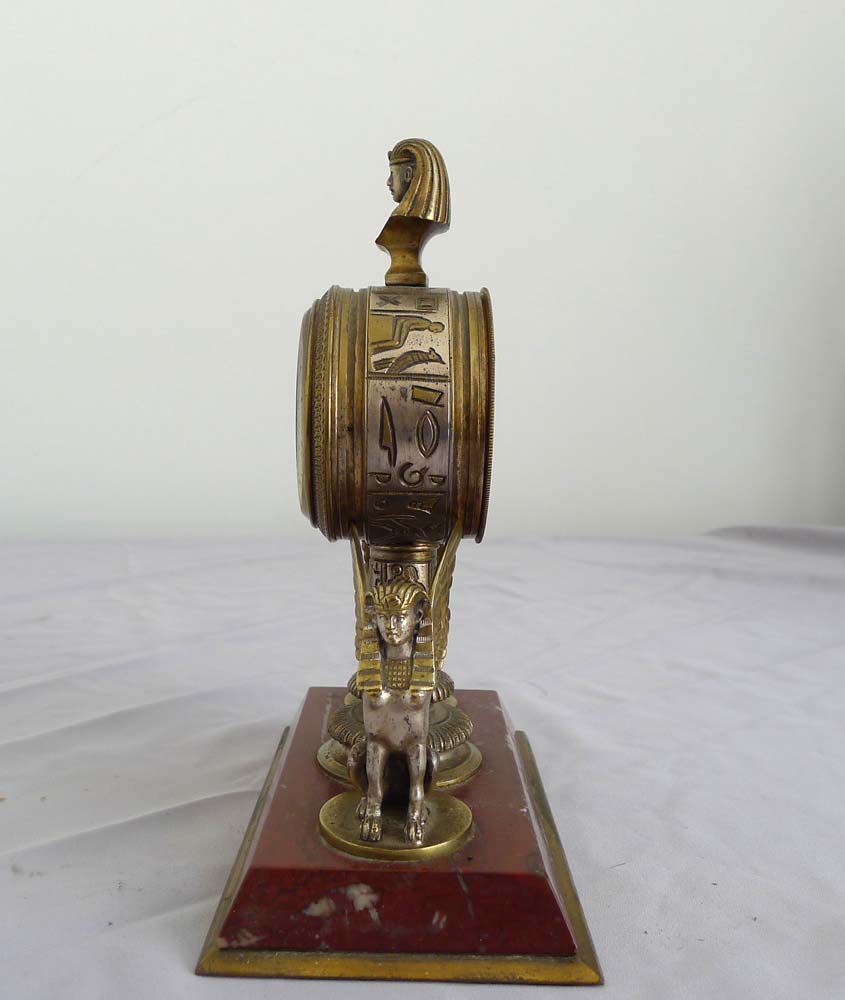 Fine and unusual desk timepiece of Retour d'Egypt or Egyptian Revival in gilt and silvered bronze.