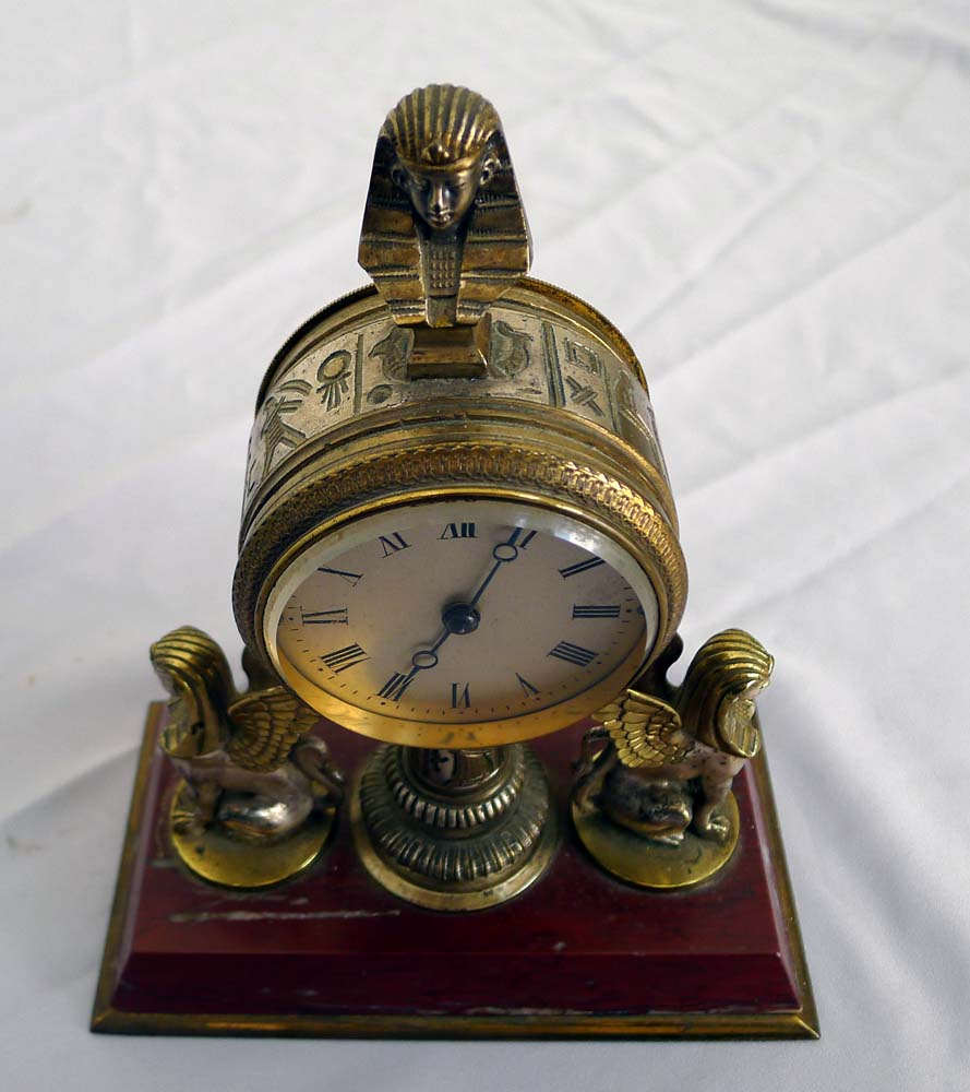 Fine and unusual desk timepiece of Retour d'Egypt or Egyptian Revival in gilt and silvered bronze.