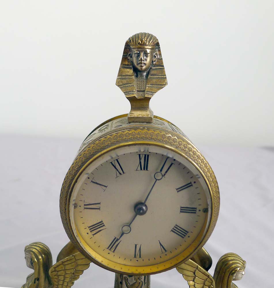 Fine and unusual desk timepiece of Retour d'Egypt or Egyptian Revival in gilt and silvered bronze.