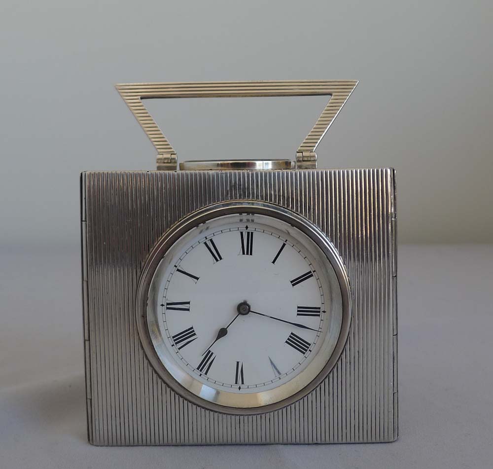 Antique silver multi dial desk clock with rare triangular case