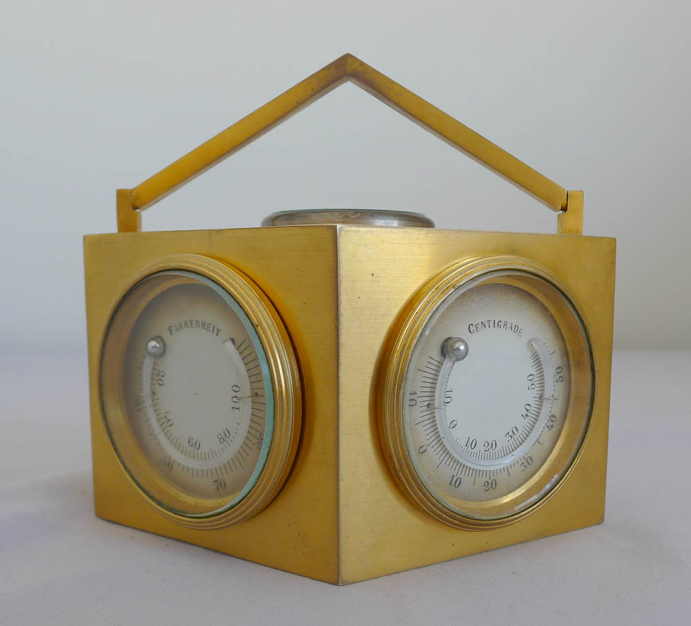 Antique weather station desk clock in an ormolu diamond shaped case.