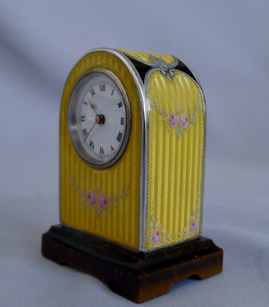 Fine silver, guilloche and hand painted enamel, cased sub-miniature clock with Tiger's Eye base.