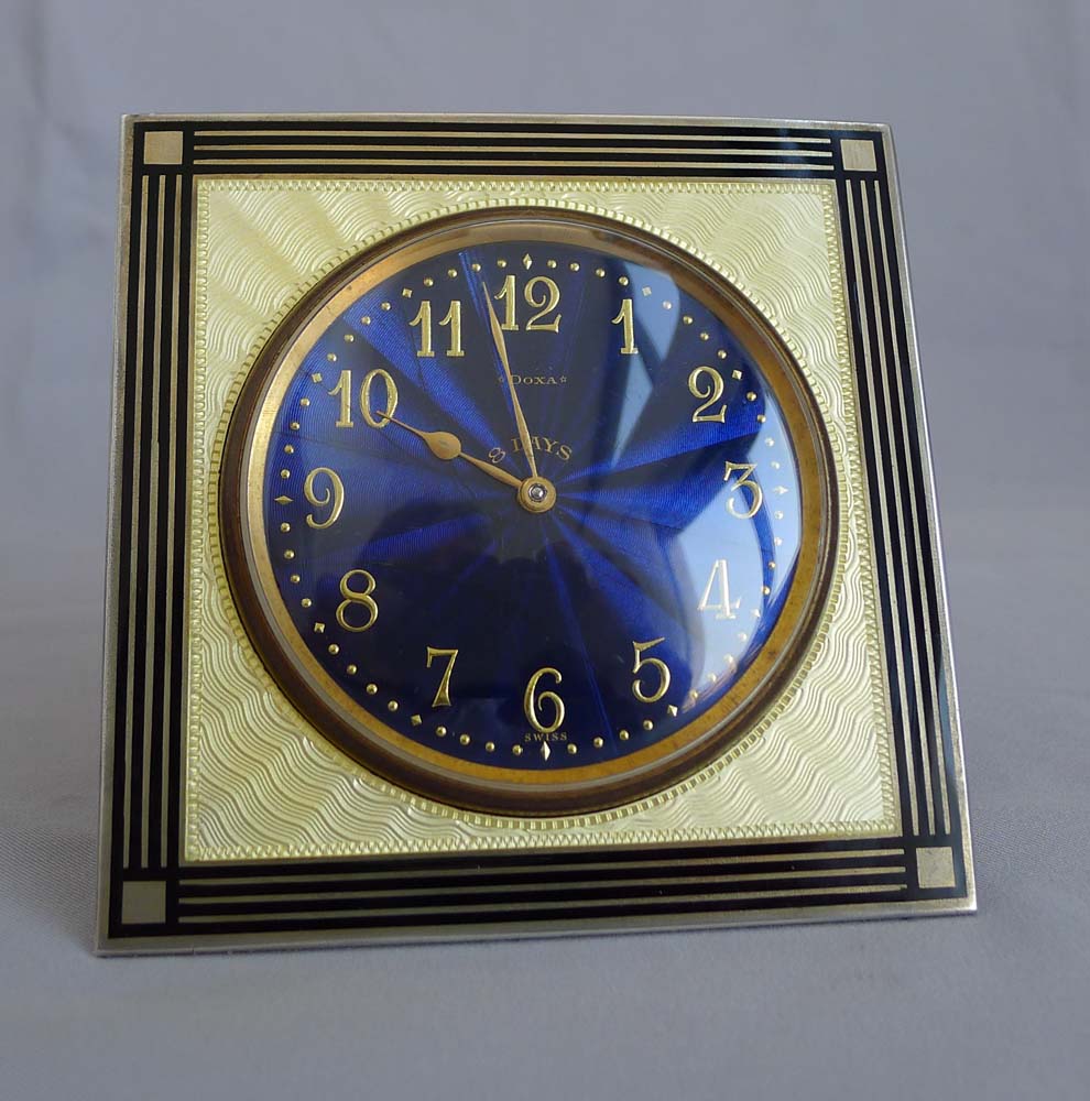 Silver and enamel strut clock with fabulous deep blue dial.