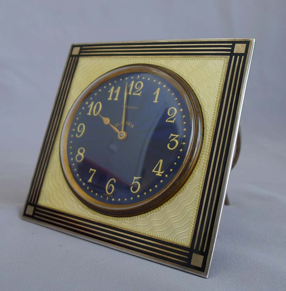 Silver and enamel strut clock with fabulous deep blue dial.