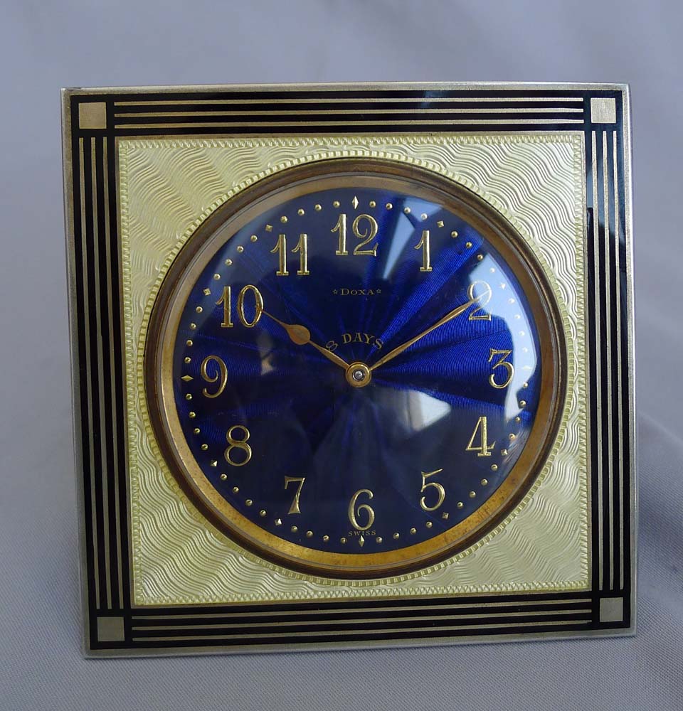 Silver and enamel strut clock with fabulous deep blue dial.