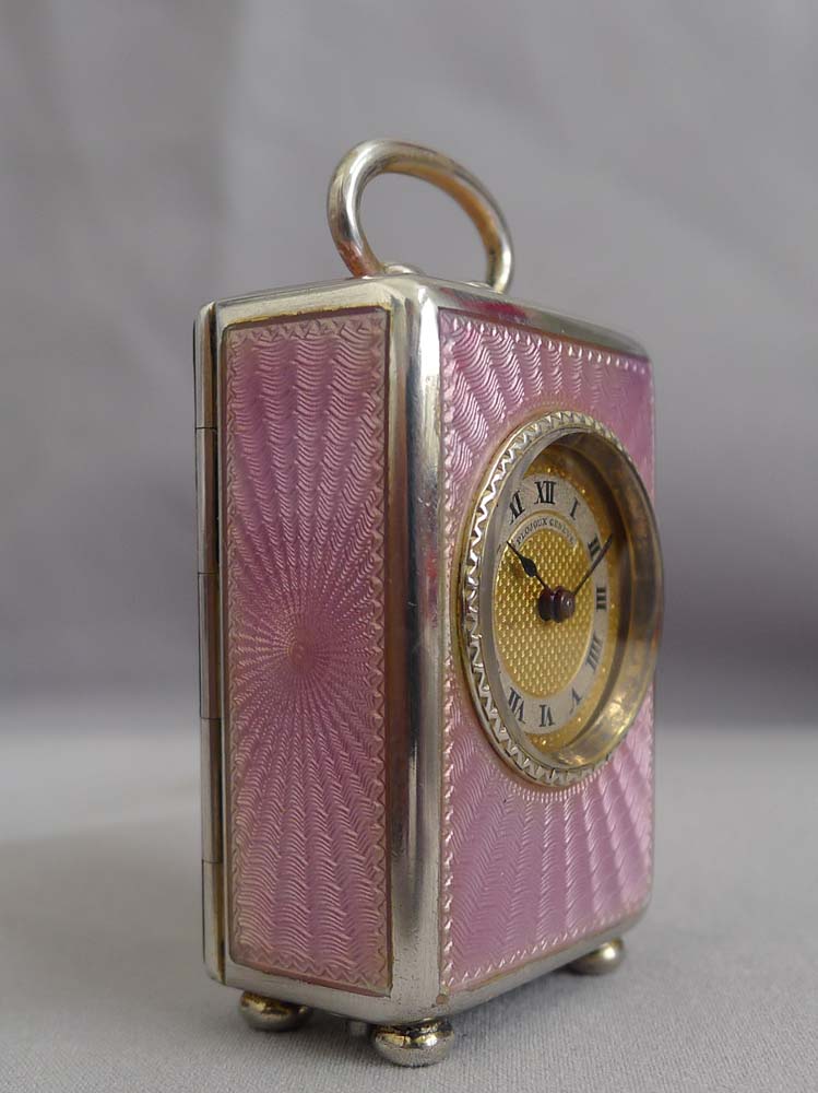 Pink guilloche enamel and silver gilt sub-miniature carriage or boudoir clock, original case and key