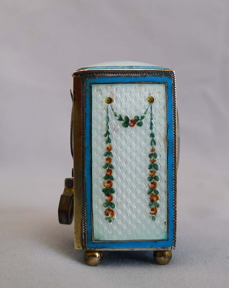Sub-miniature carriage clock with hand painted guilloche enamel.