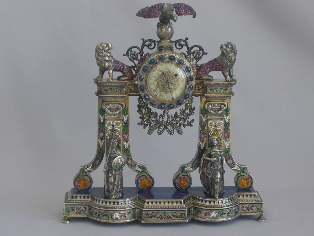 Spectacular antique Viennese silver gilt, enamel and jewelled clock modelled as a fire surround