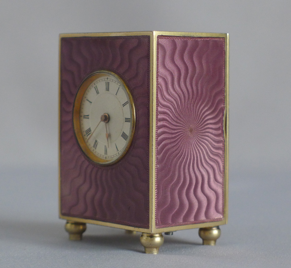 Fine silver gilt, and pink guilloche enamel sub minature carriage or boudoir clock in original case
