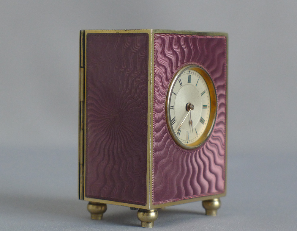 Fine silver gilt, and pink guilloche enamel sub minature carriage or boudoir clock in original case