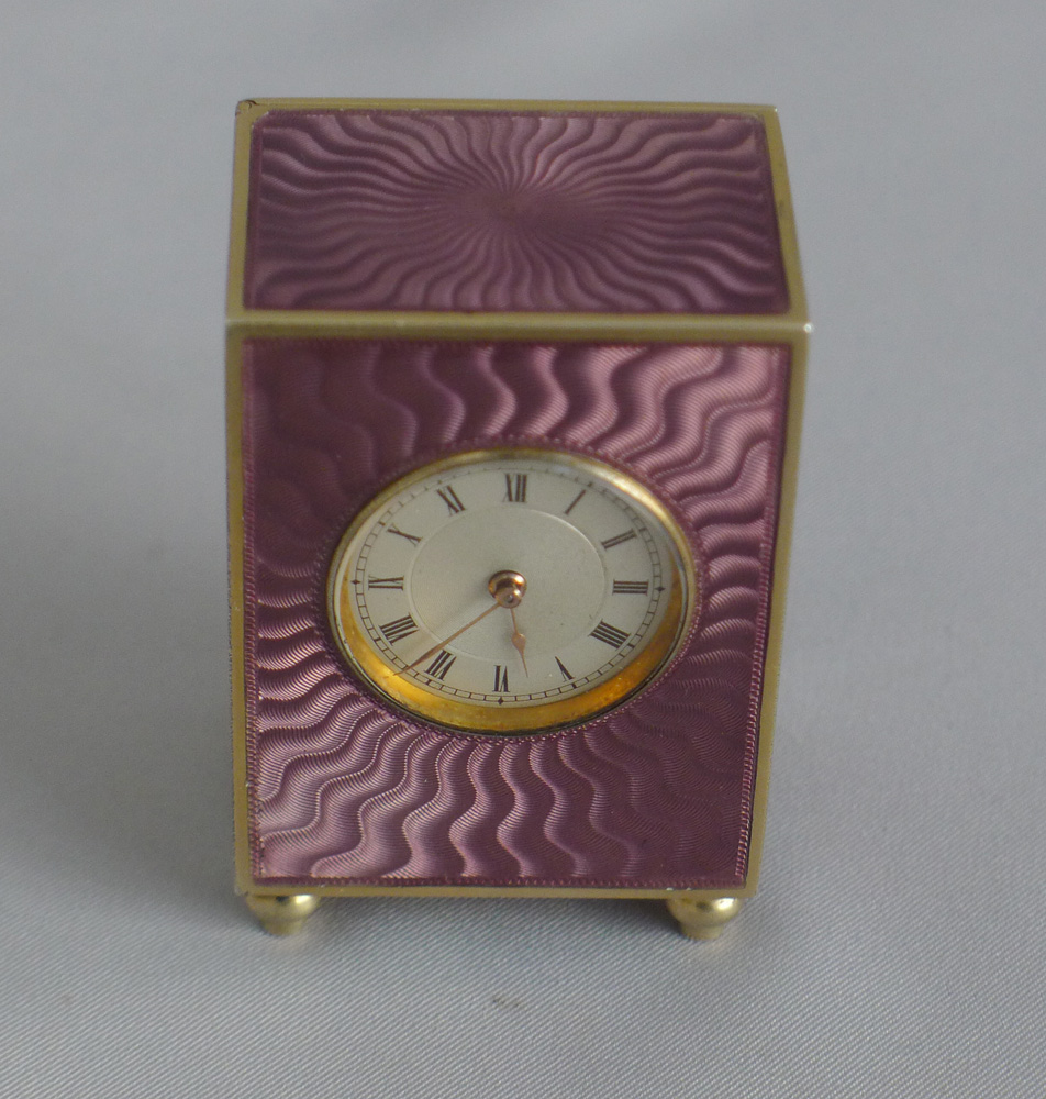 Fine silver gilt, and pink guilloche enamel sub minature carriage or boudoir clock in original case
