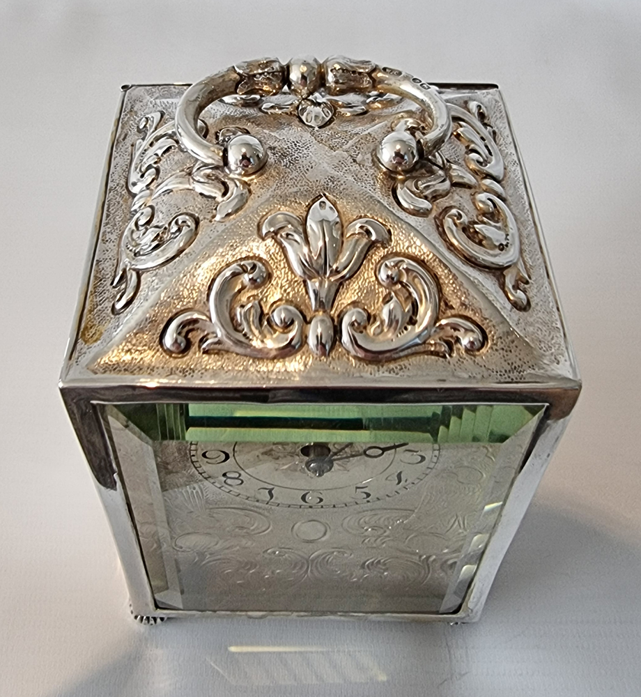 Antique English Silver repousse striking Carriage Clock by William Comyns