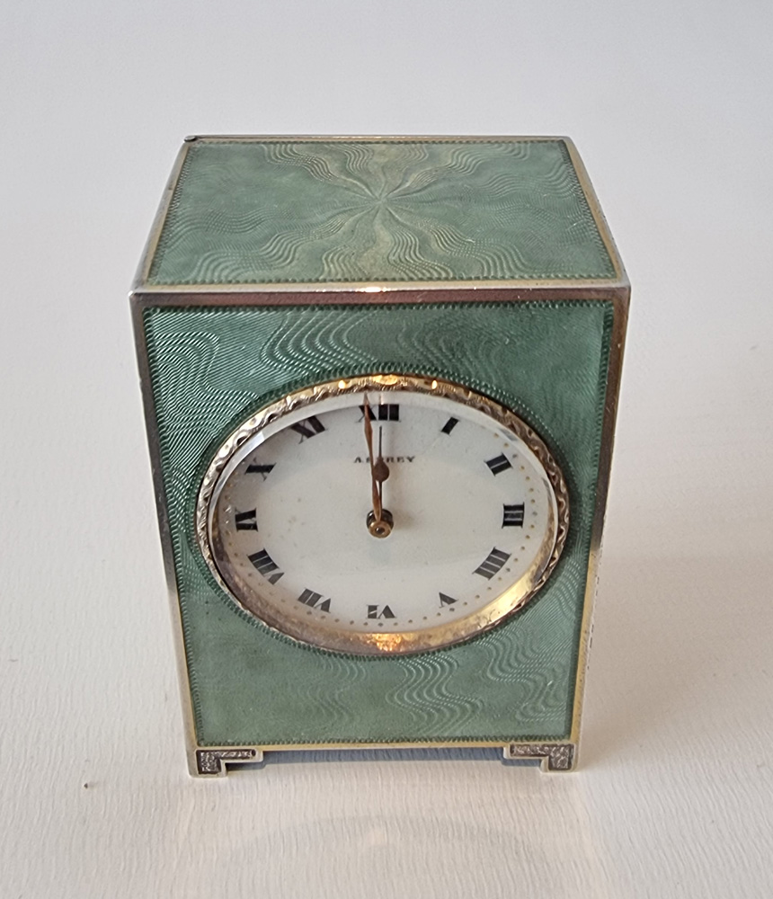 A fine Asprey Silver and Guilloche enamel miniature boudoir clock in original case