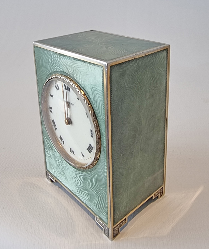 A fine Asprey Silver and Guilloche enamel miniature boudoir clock in original case