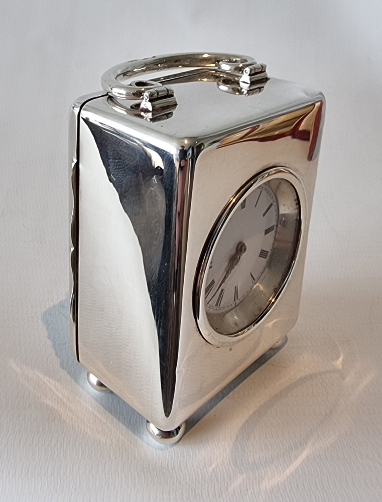 A Miniature Silver Carriage Clock in original case by W. Thornhill