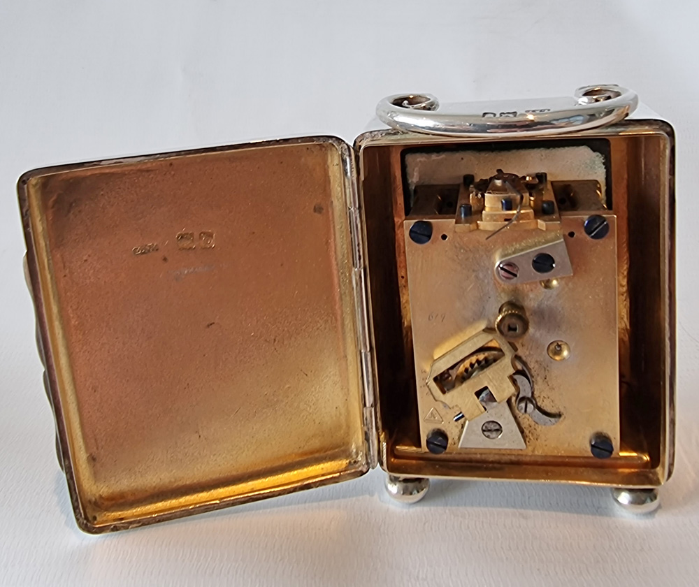 A Miniature Silver Carriage Clock in original case by W. Thornhill
