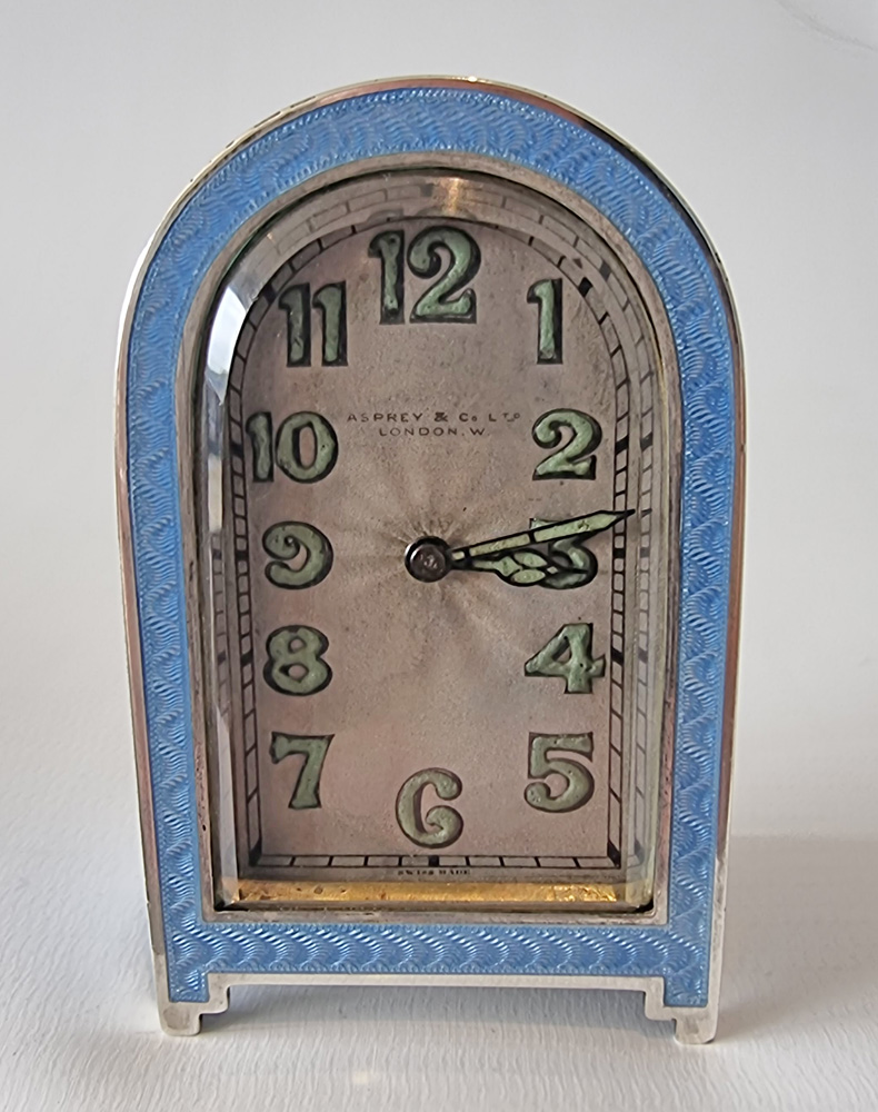 A fine Art Deco silver gilt and blue guilloche enamel boudoir clock by Asprey's of London.