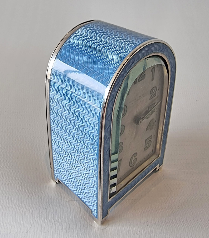 A fine Art Deco silver gilt and blue guilloche enamel boudoir clock by Asprey's of London.
