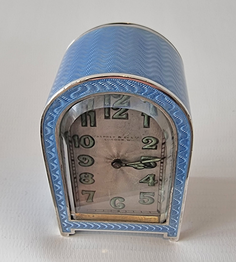 A fine Art Deco silver gilt and blue guilloche enamel boudoir clock by Asprey's of London.