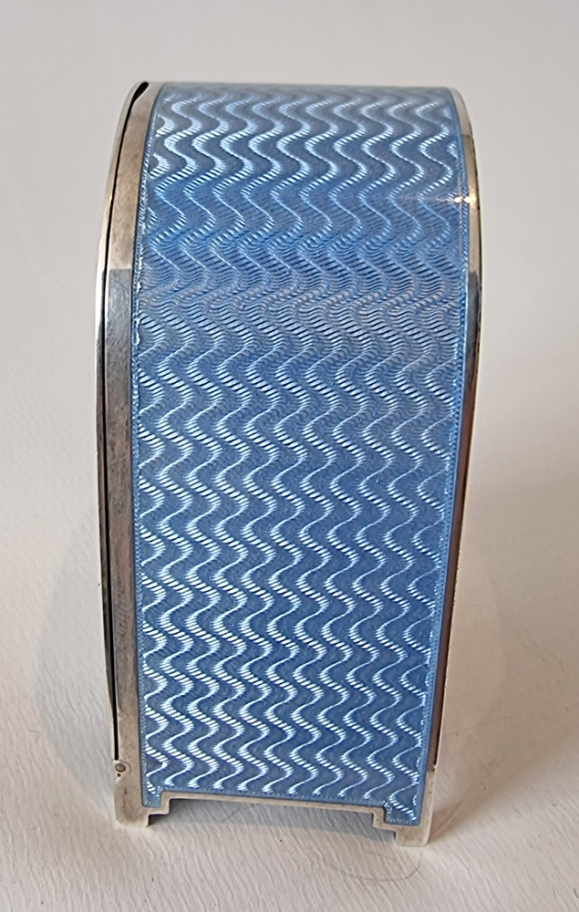 A fine Art Deco silver gilt and blue guilloche enamel boudoir clock by Asprey's of London.