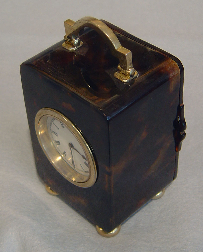  English tortoiseshell and silver gilt carriage clock.
