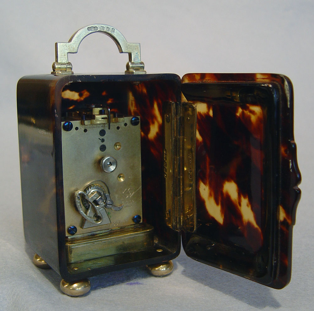  English tortoiseshell and silver gilt carriage clock.