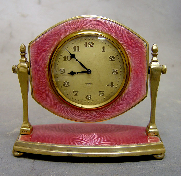 English silver & pink guilloche enamel mirror strut clock in case.