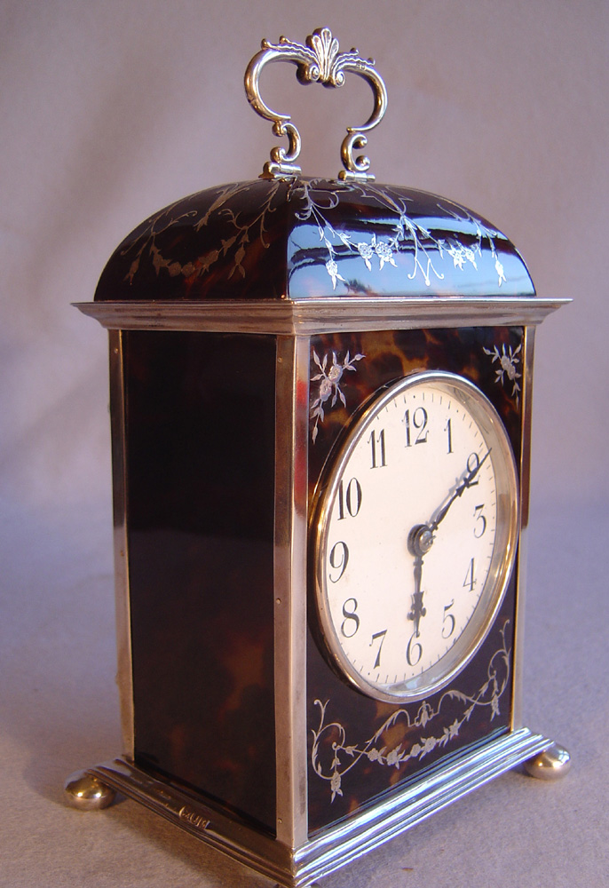 Antique English Dome topped tortoiseshell and silver pique large carriage clock by William Comyns.