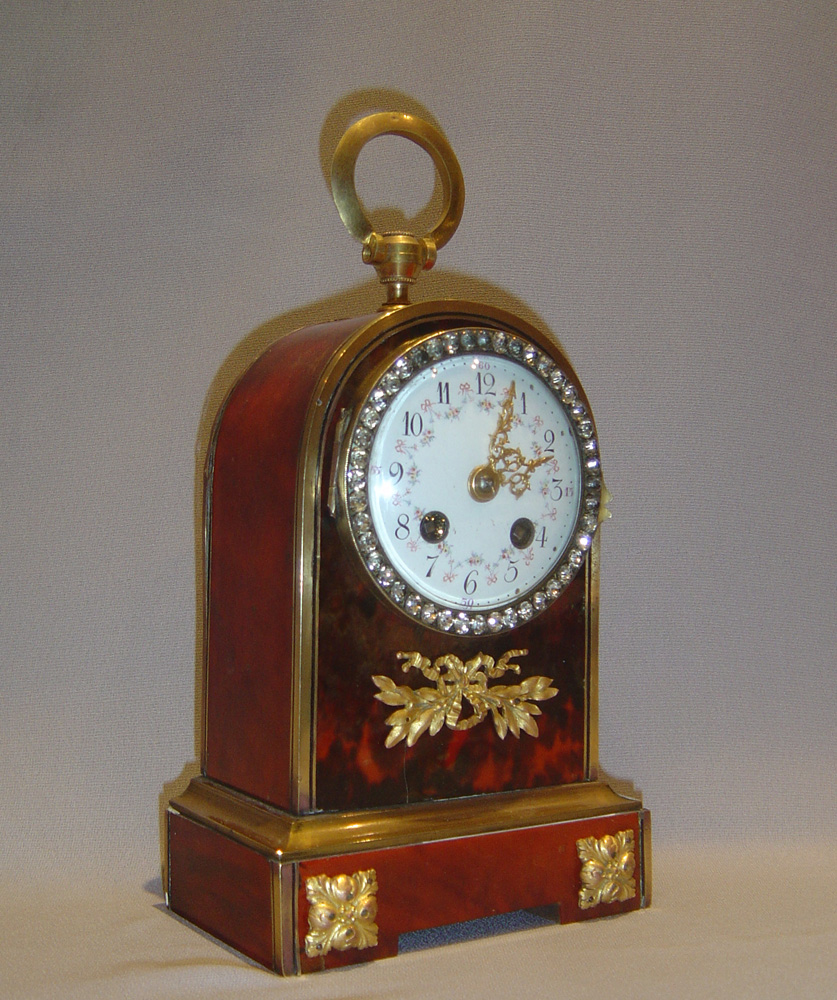 Antique English jewelled scarlet tortoiseshell and gilt bronze clockclock.