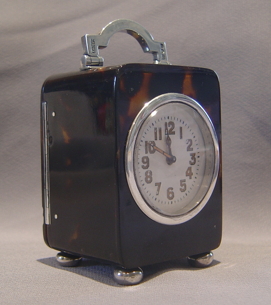 Antique English Edwardian tortoiseshell and silver mounted carriage clock.