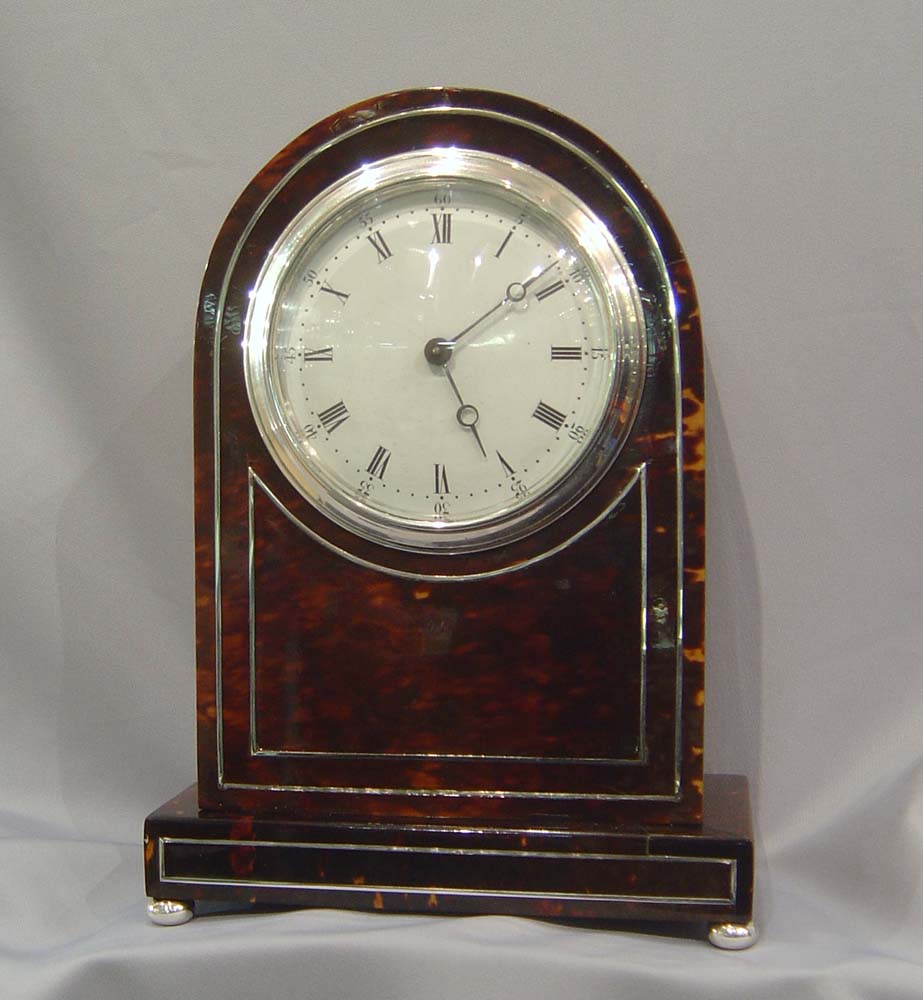 Antique English dome topped tortoiseshell mantel clock.