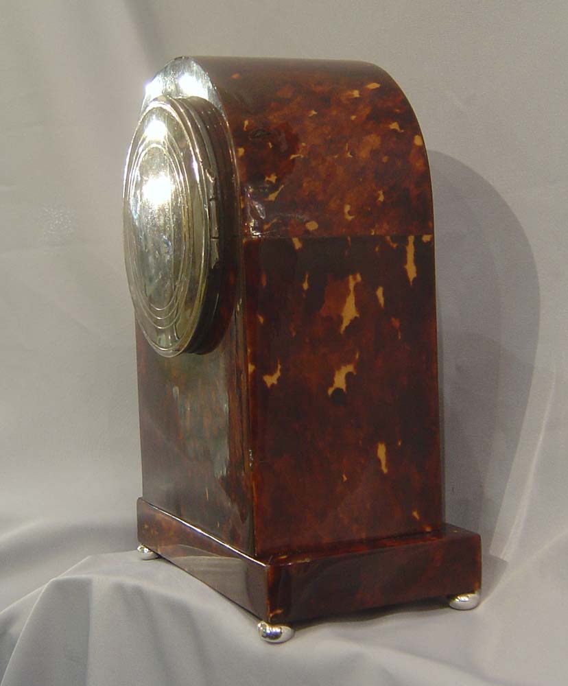 Antique English dome topped tortoiseshell mantel clock.