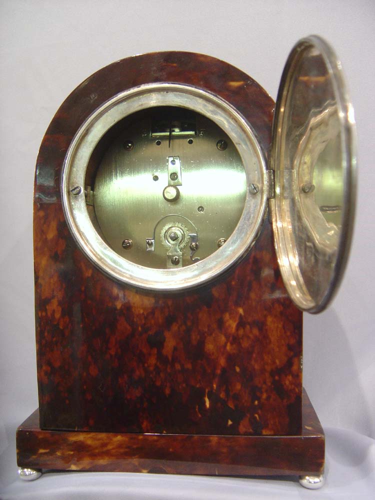 Antique English dome topped tortoiseshell mantel clock.