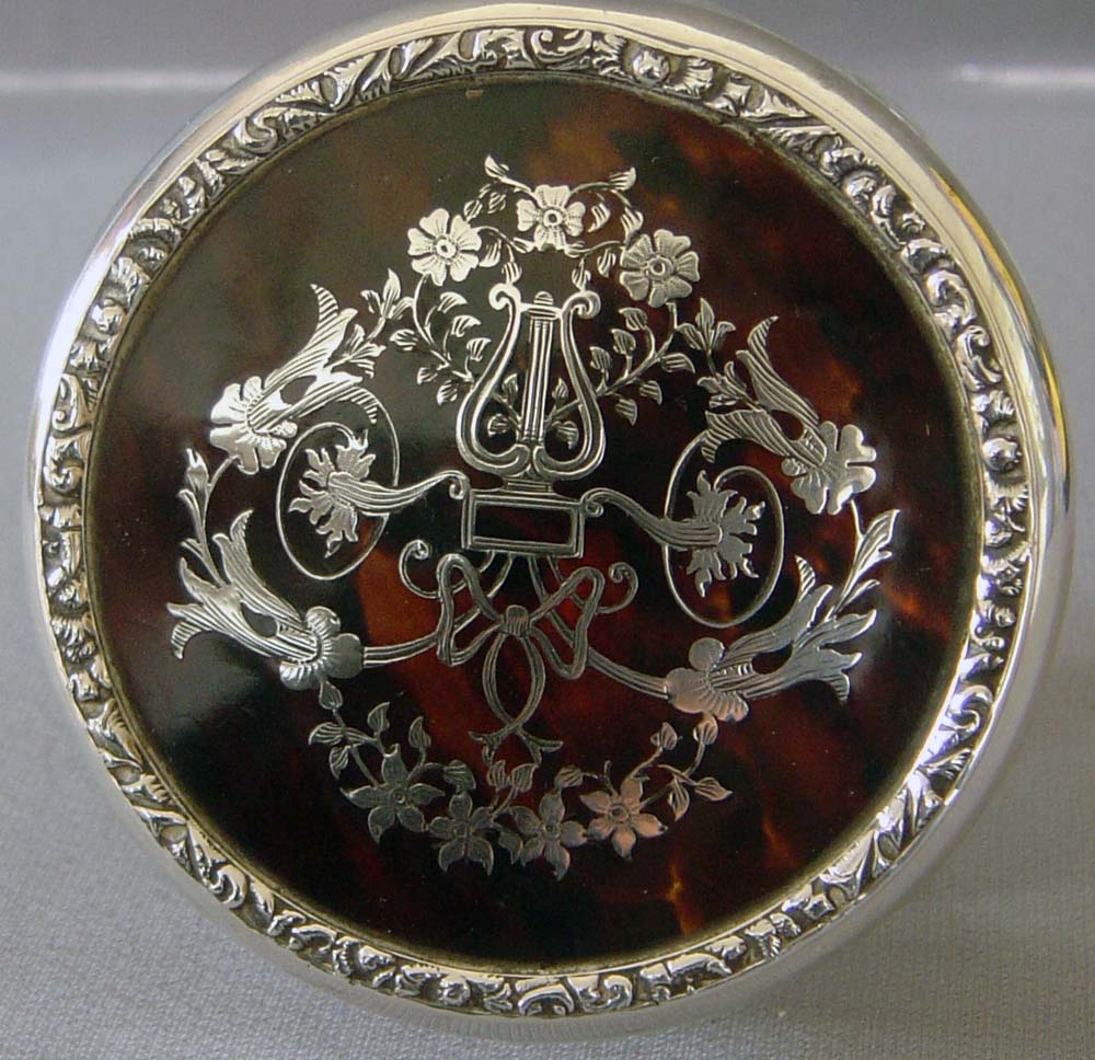 Silver and tortoiseshell and silver picquet glass jar.