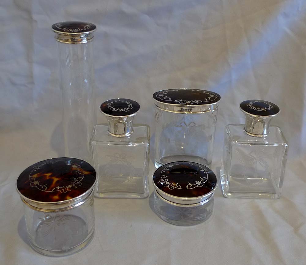 Tortoiseshell and silver picque lidded six glass jars London 1929.