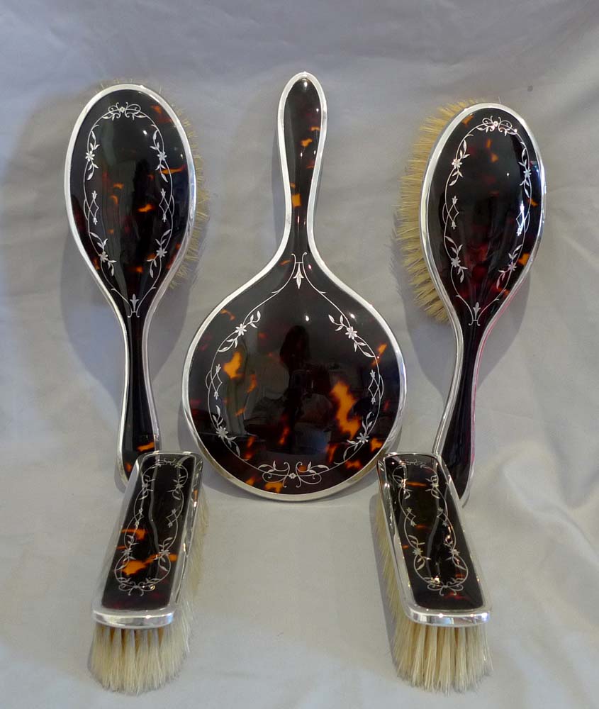 Tortoiseshell and silver picque 5 piece brush and mirror set (unused) London 1929.