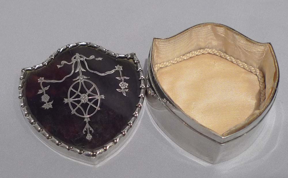 Antique English silver and tortoiseshell box in shield shape with silver piquet