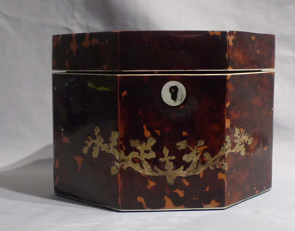 Antique tortoiseshell and brass inlaid tea caddy.