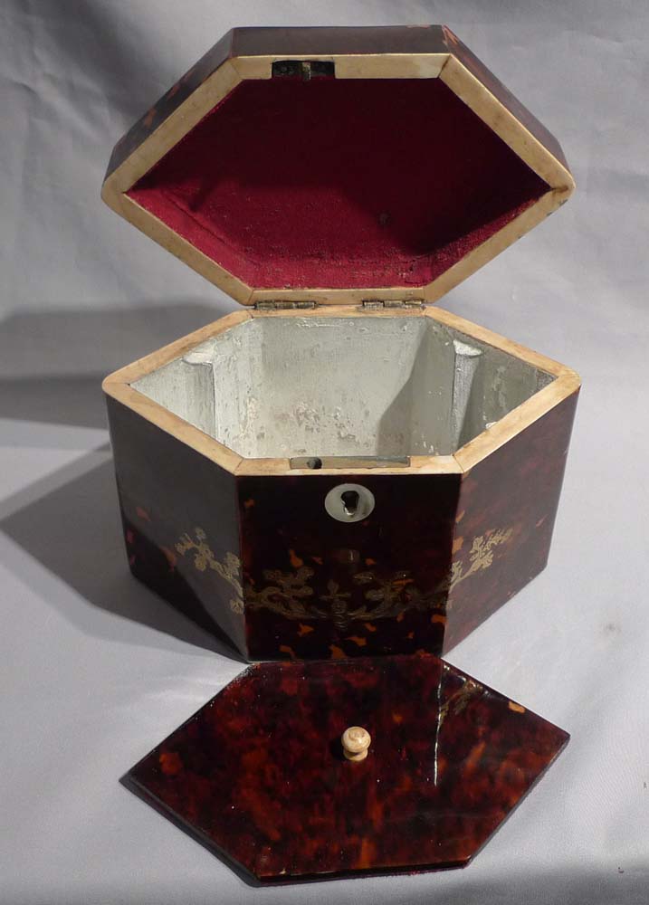 Antique tortoiseshell and brass inlaid tea caddy.