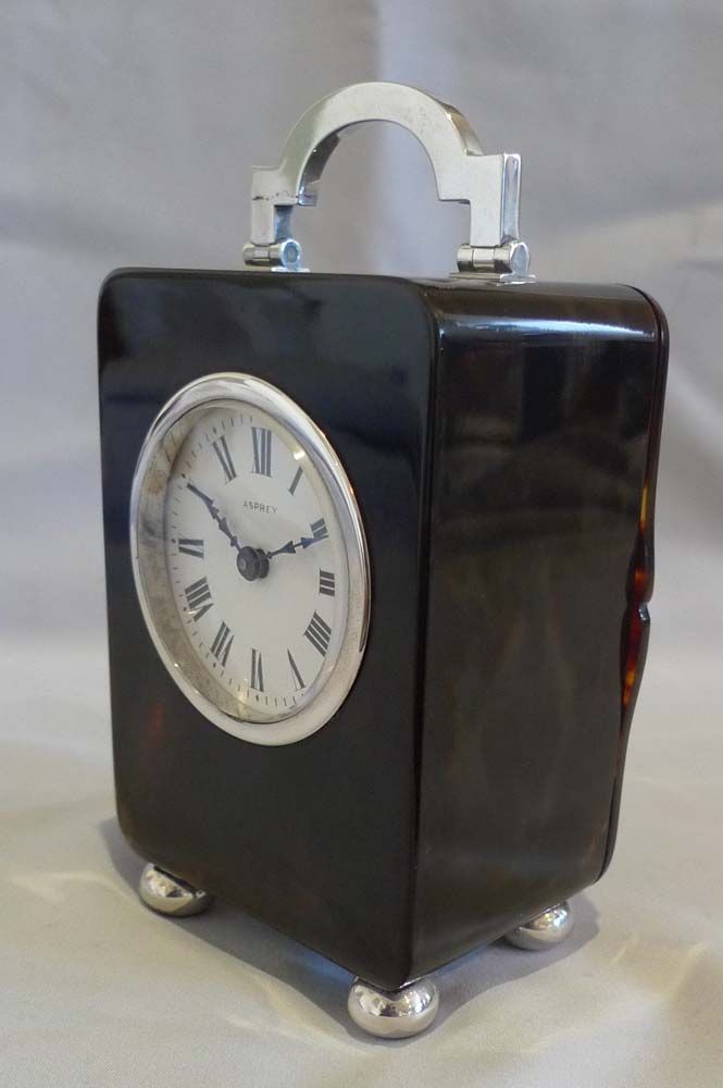 Antique tortoiseshell and silver carriage clock by Asprey of London.