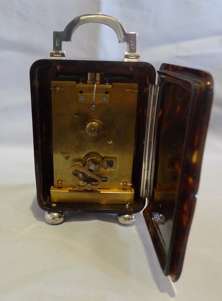 Antique tortoiseshell and silver carriage clock by Asprey of London.