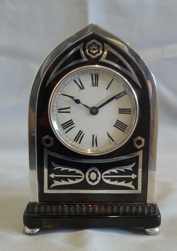 Antique English Gothic design lancet topped  tortoiseshell & silver mounted clock by William Comyns.