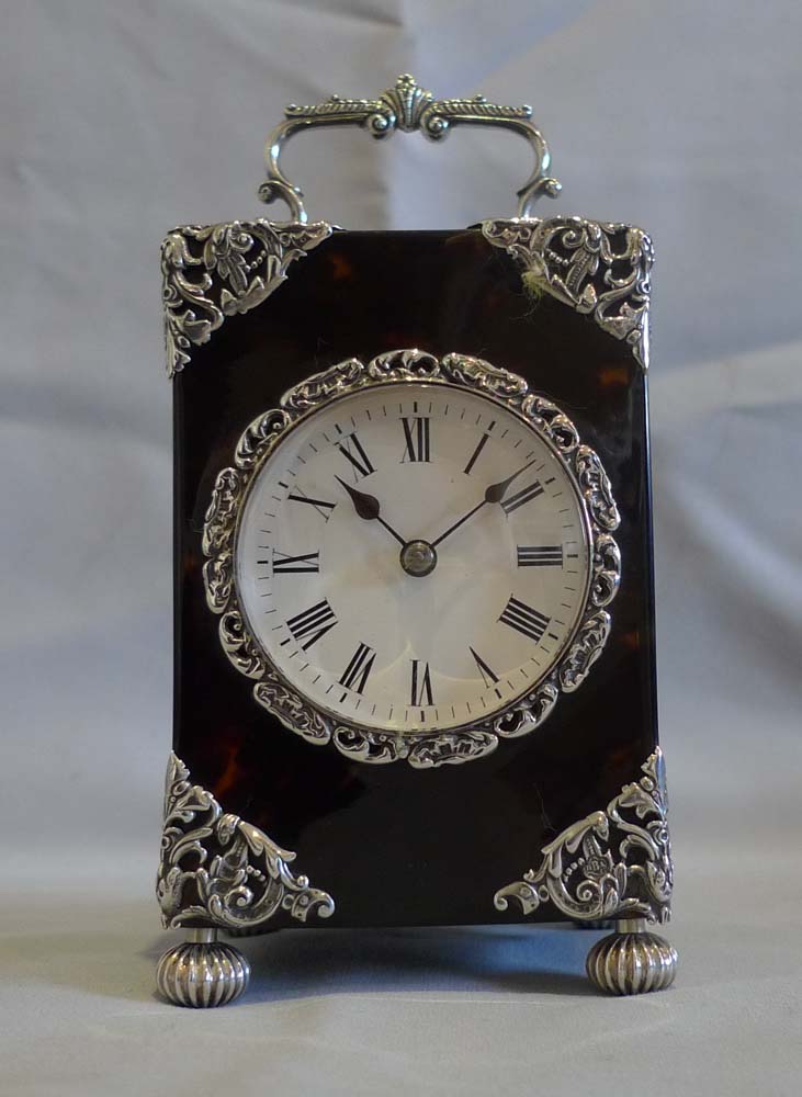 Antique English silver mounted & tortoiseshell carriage clock of substantial size.