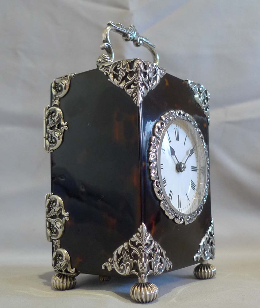 Antique English silver mounted & tortoiseshell carriage clock of substantial size.