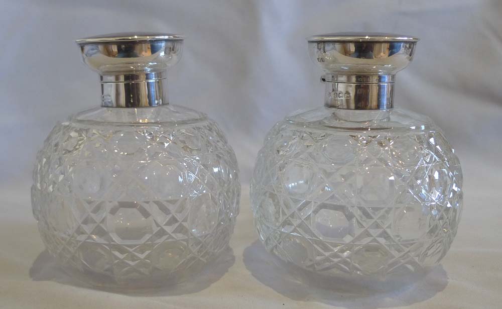Pair tortoiseshell pique silver and cut glass spherical perfume bottles.