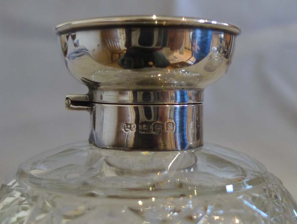 Pair tortoiseshell pique silver and cut glass spherical perfume bottles.